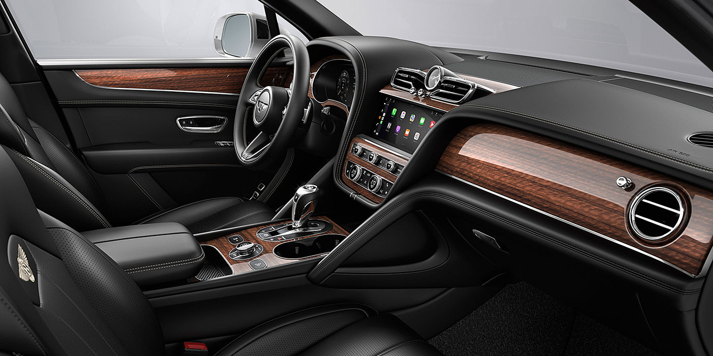 Bentley Chongqing Bentley Bentayga interior with a Crown Cut Walnut veneer, view from the passenger seat over looking the driver's seat.
