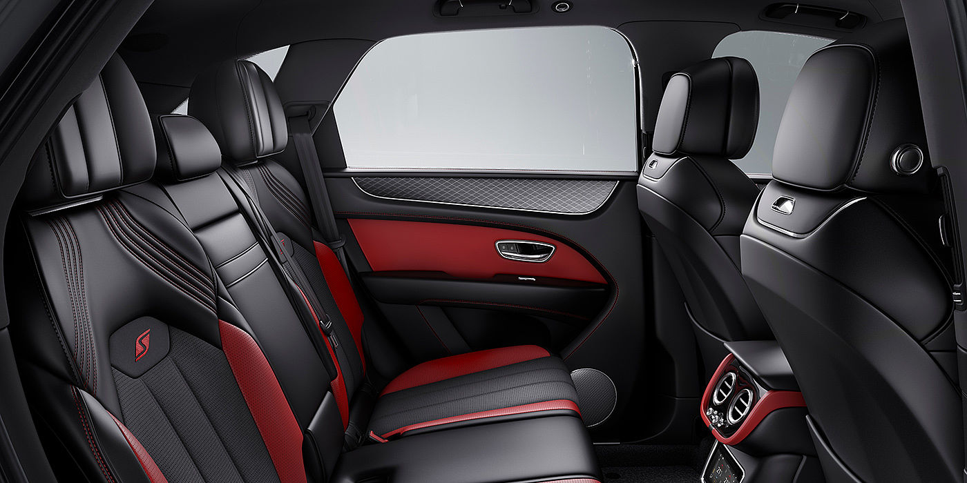 Bentley Chongqing Bentey Bentayga S interior view for rear passengers with Beluga black and Hotspur red coloured hide.